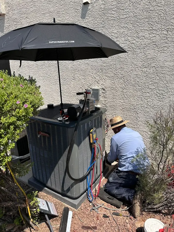 HVAC technician performing outdoor AC maintenance in Miami Gardens